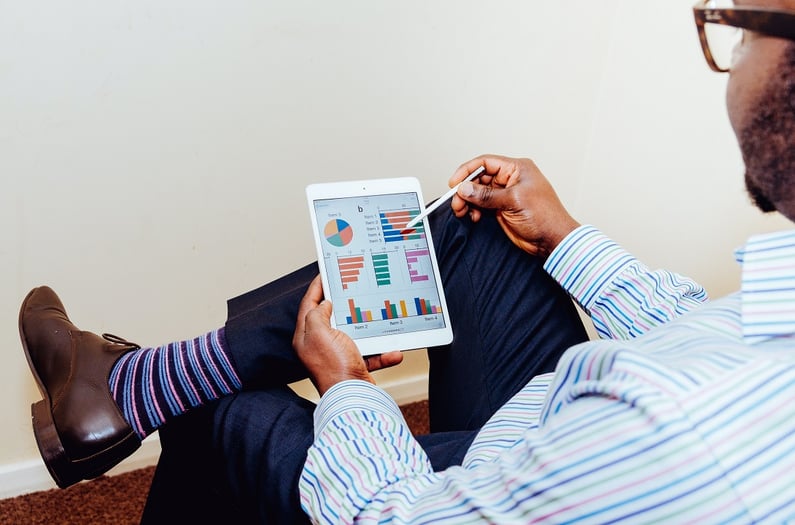 man holding a tablet and stylus
