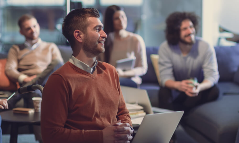 Salespeople listening a training in a sales kick off event